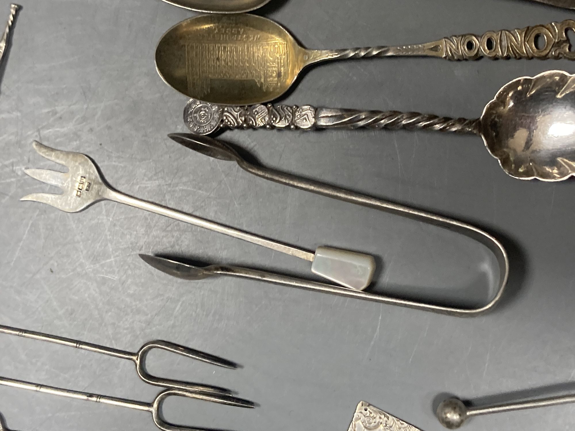 A group of assorted Chinese white metal spoons and forks, including set of six teaspoons and ten small items of English silver.